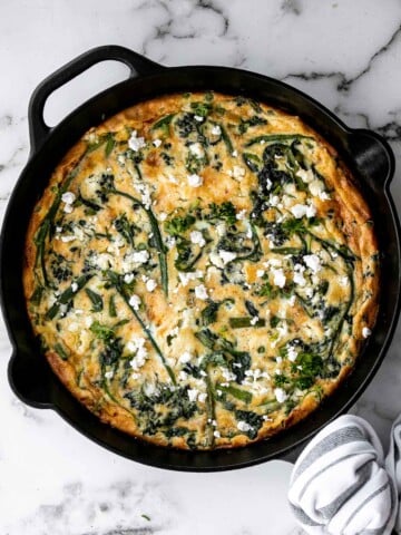 Spring vegetable frittata is a delicious breakfast or served at any time of the day. It's a one-pan meal that starts on the stove and moves to the oven. | aheadofthyme.com