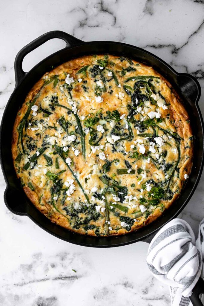 Spring vegetable frittata is a delicious breakfast or served at any time of the day. It's a one-pan meal that starts on the stove and moves to the oven. | aheadofthyme.com