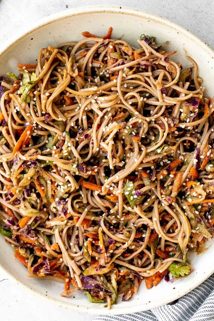 There’s nothing better on a hot day than a cold and refreshing vegan soba noodle salad, tossed with fresh vegetables and a delicious saucy dressing. | aheadofthyme.com