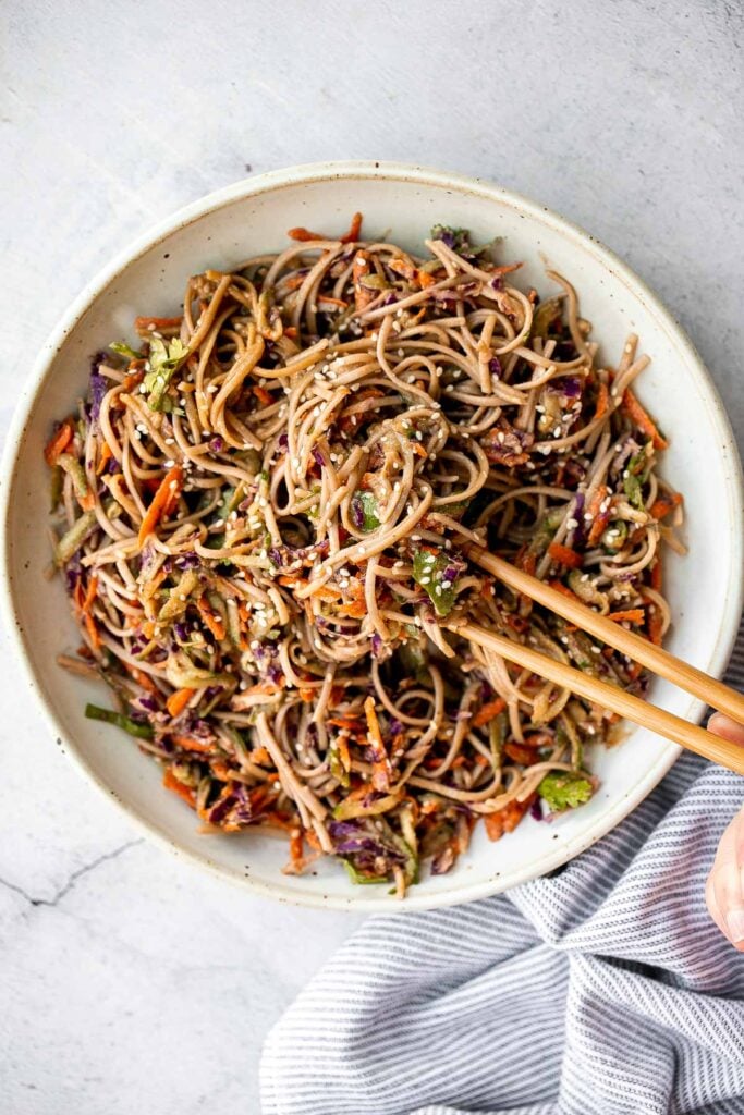 There’s nothing better on a hot day than a cold and refreshing vegan soba noodle salad, tossed with fresh vegetables and a delicious saucy dressing. | aheadofthyme.com