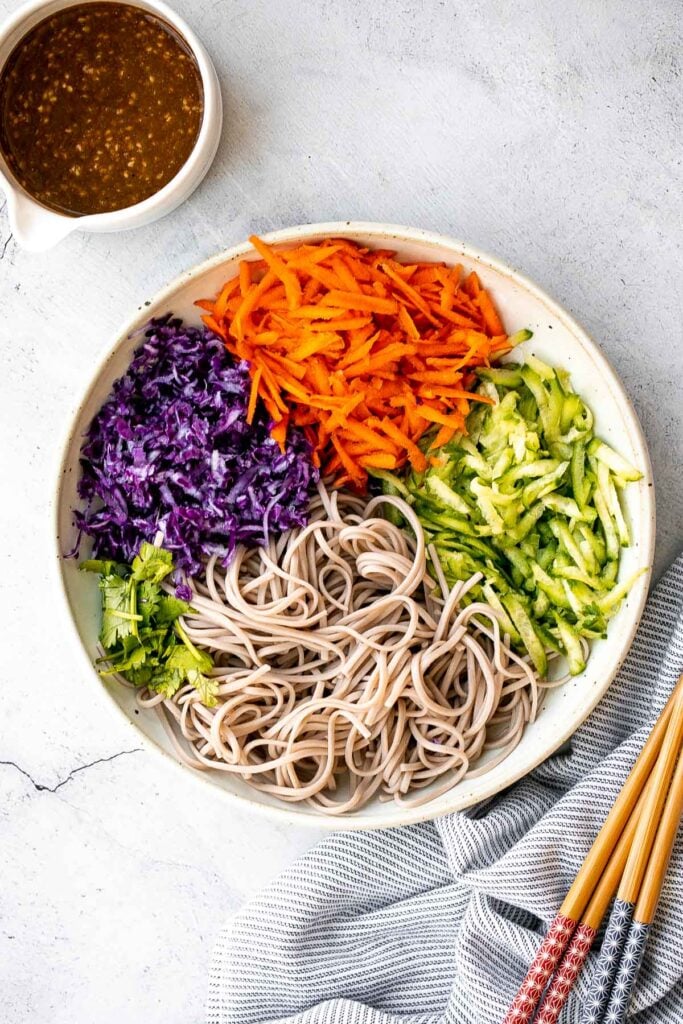 There’s nothing better on a hot day than a cold and refreshing vegan soba noodle salad, tossed with fresh vegetables and a delicious saucy dressing. | aheadofthyme.com