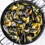 Yellow curry mussels are the epitome of delicious seafood - creamy, spicy, and savory. This flavourful one pot dish is quick + easy to make in 25 minutes. | aheadofthyme.com