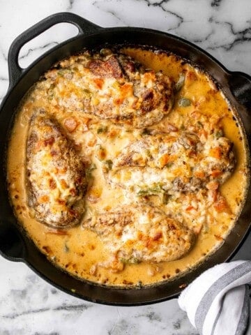 Baked queso chicken with tomatoes is an easy, cheesy, delicious chicken dinner that takes just 30 minutes to cook. The best weeknight dinner. | aheadofthyme.com