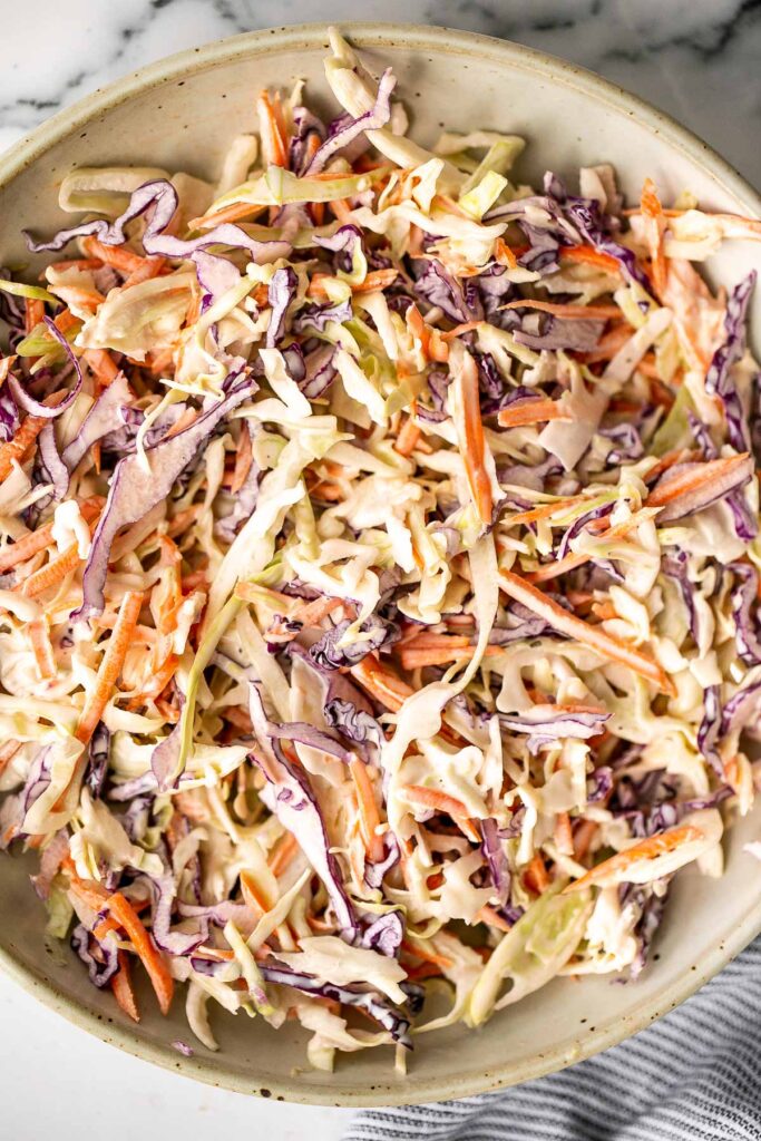 Fresh, crisp, classic coleslaw salad is a must-have recipe for a summer barbecue or picnic, or as an easy make-ahead lunch. Make it in less than 10 minutes. | aheadofthyme.com