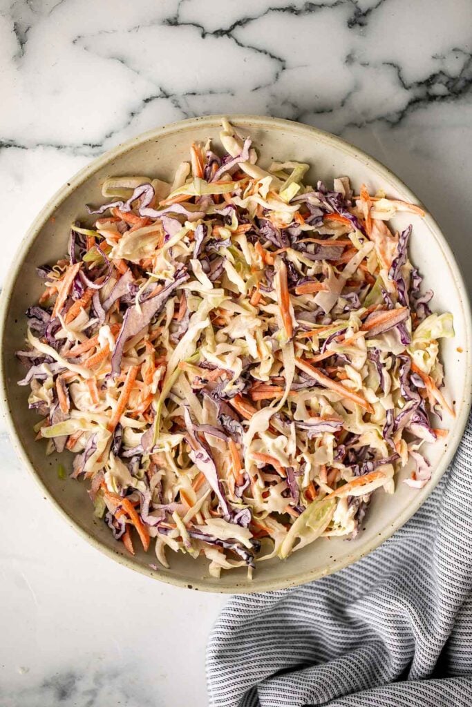 Fresh, crisp, classic coleslaw salad is a must-have recipe for a summer barbecue or picnic, or as an easy make-ahead lunch. Make it in less than 10 minutes. | aheadofthyme.com