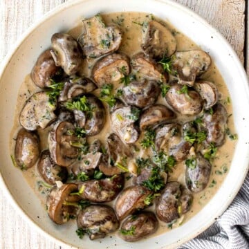 Creamy garlic mushrooms are a simple, delicious, and easy side dish. This comforting family favorite that is quick and easy to make in just 15 minutes. | aheadofthyme.com