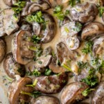 Creamy Garlic Mushrooms with Parmesan are rich, buttery, and ready in 15 minutes. A quick one-pan side dish or pasta topper! | aheadofthyme.com