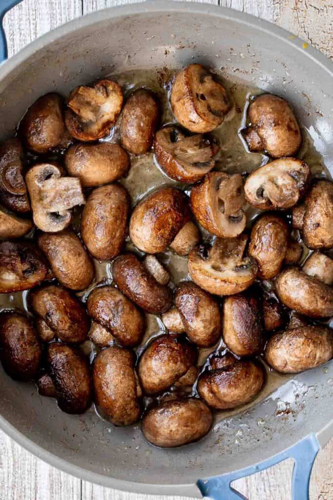 Creamy Garlic Mushrooms with Parmesan are rich, buttery, and ready in 15 minutes. A quick one-pan side dish or pasta topper! | aheadofthyme.com