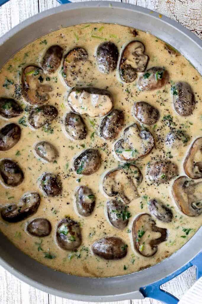Creamy Garlic Mushrooms with Parmesan are rich, buttery, and ready in 15 minutes. A quick one-pan side dish or pasta topper! | aheadofthyme.com