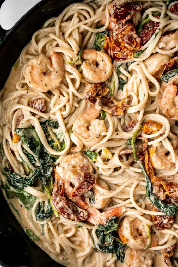 Creamy shrimp pasta with sun-dried tomatoes is a delicious, quick and easy meal that takes just 20 minutes to prep and make. The perfect weeknight dinner. | aheadofthyme.com