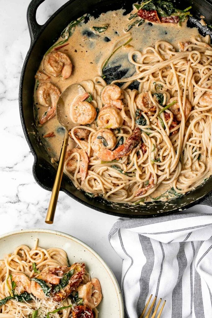 Creamy shrimp pasta with sun-dried tomatoes is a delicious, quick and easy meal that takes just 20 minutes to prep and make. The perfect weeknight dinner. | aheadofthyme.com