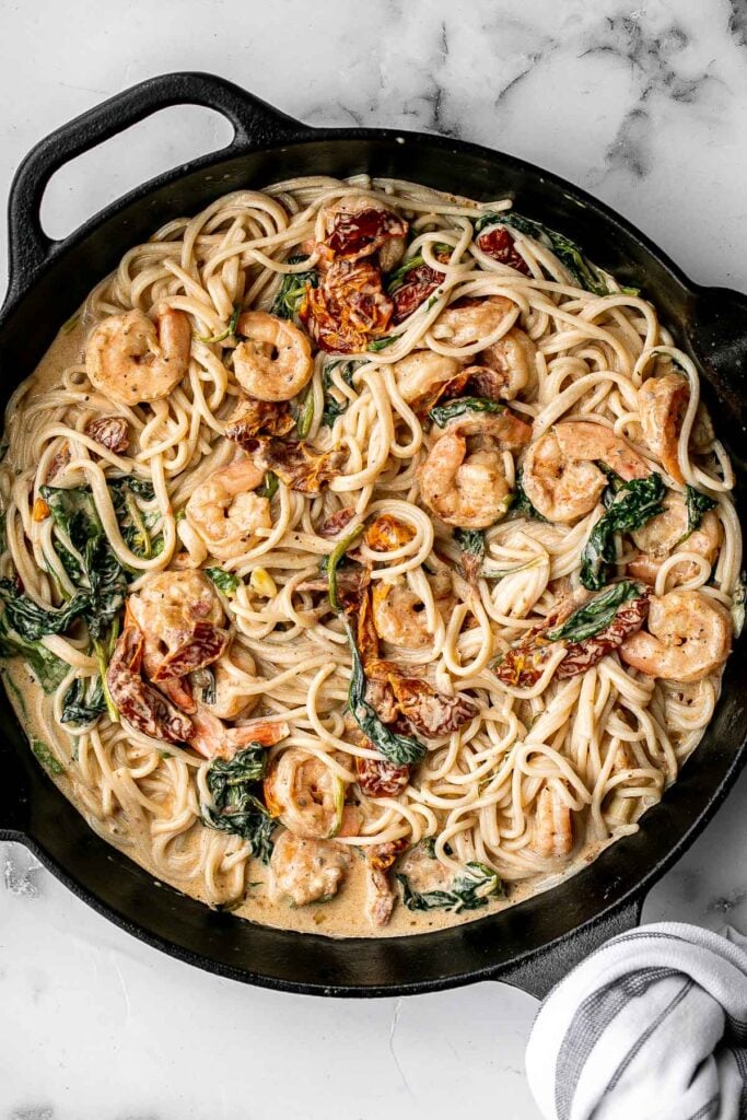 Creamy shrimp pasta with sun-dried tomatoes is a delicious, quick and easy meal that takes just 20 minutes to prep and make. The perfect weeknight dinner. | aheadofthyme.com