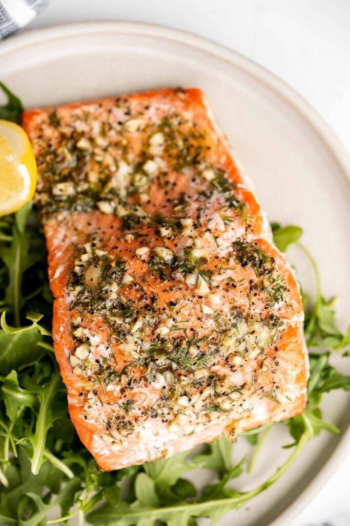 Greek salmon is delicious, flaky, and tender. This healthy oven-baked salmon is packed with Mediterranean flavors and is ready in just 20 minutes. | aheadofthyme.com