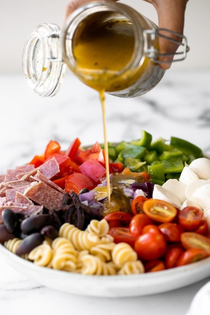 Italian pasta salad is delicious, wholesome, and easy to make. Make it up to three days ahead for your summer picnics and cookouts. | aheadofthyme.com