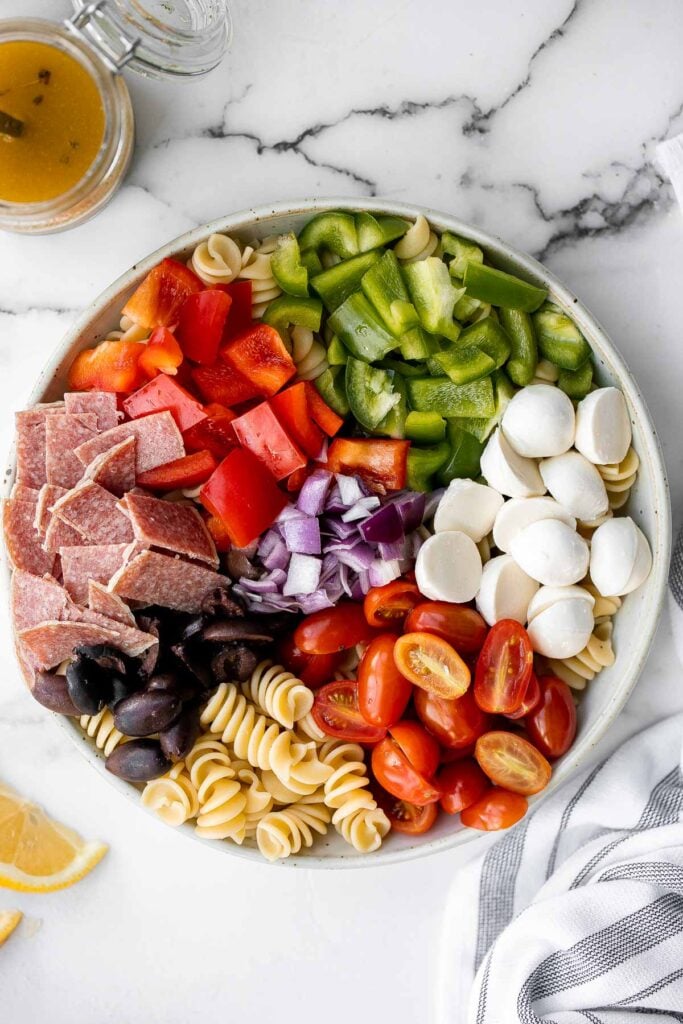 Italian pasta salad is delicious, wholesome, and easy to make. Make it up to three days ahead for your summer picnics and cookouts. | aheadofthyme.com