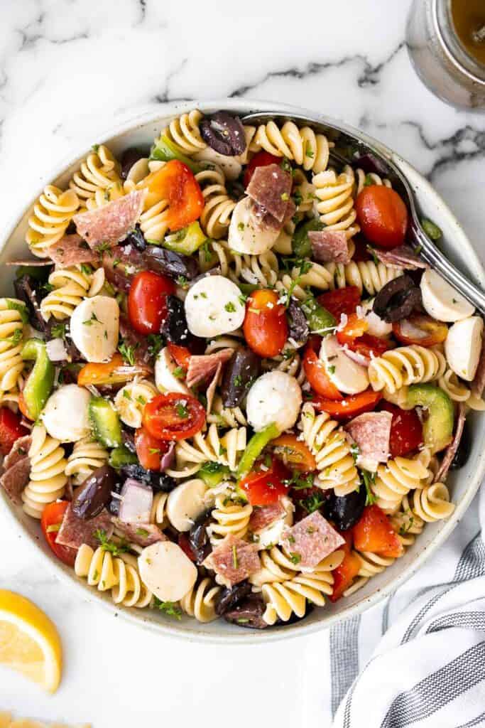 Italian pasta salad is delicious, wholesome, and easy to make. Make it up to three days ahead for your summer picnics and cookouts. | aheadofthyme.com
