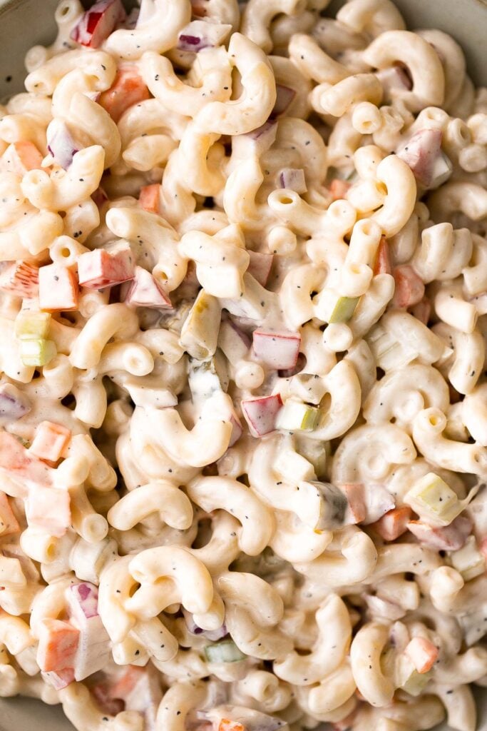 Classic macaroni salad is a creamy and delicious pasta salad that is easy to throw together. It's the perfect side to bring to a summer potluck or BBQ. | aheadofthyme.com