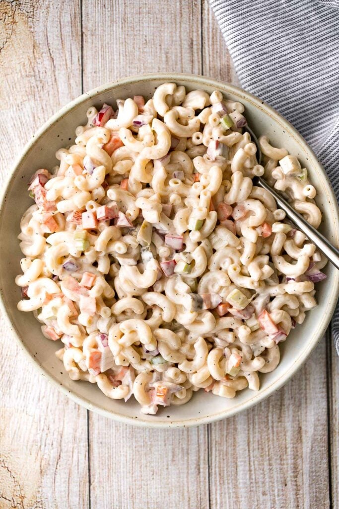 Classic macaroni salad is a creamy and delicious pasta salad that is easy to throw together. It's the perfect side to bring to a summer potluck or BBQ. | aheadofthyme.com