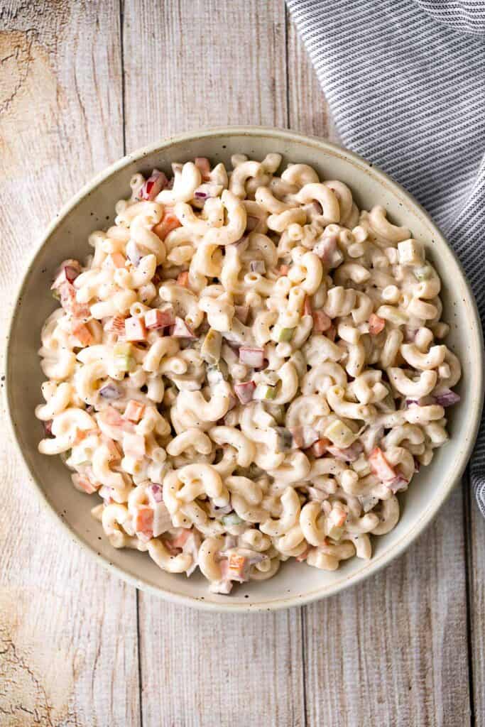 Classic macaroni salad is a creamy and delicious pasta salad that is easy to throw together. It's the perfect side to bring to a summer potluck or BBQ. | aheadofthyme.com