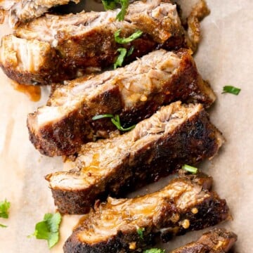 Slow cooker BBQ ribs are juicy, saucy, and tender -- the meat literally falls right off the bone. Add this easy recipe to your list of crockpot recipes. | aheadofthyme.com