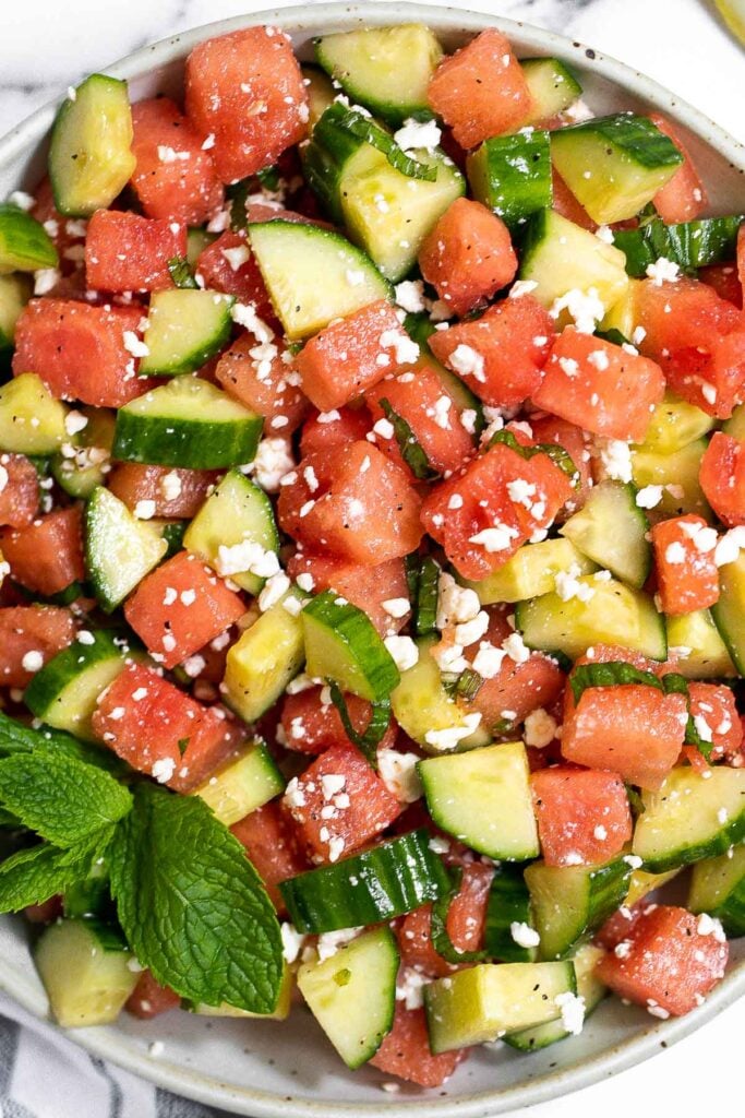 Watermelon feta salad with cucumbers and mint is a simple and delicious refreshing summer salad that you can toss together in 5 minutes. | aheadofthyme.com