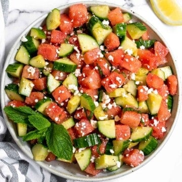 Watermelon feta salad with cucumbers and mint is a simple and delicious refreshing summer salad that you can toss together in 5 minutes. | aheadofthyme.com