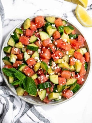 Watermelon feta salad with cucumbers and mint is a simple and delicious refreshing summer salad that you can toss together in 5 minutes. | aheadofthyme.com