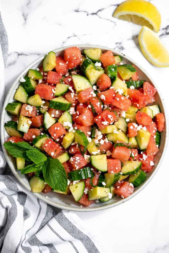 Watermelon feta salad with cucumbers and mint is a simple and delicious refreshing summer salad that you can toss together in 5 minutes. | aheadofthyme.com