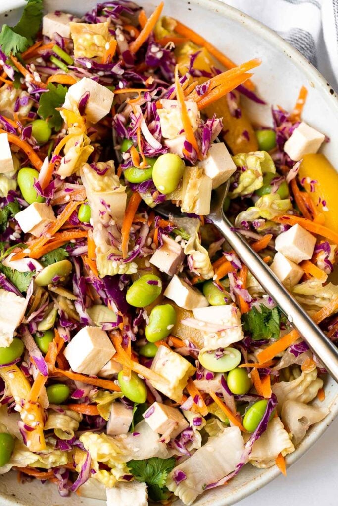 Asian chopped salad is a delicious and colorful salad, loaded with refreshing crisp vegetables, plant-based protein, and a homemade creamy sesame dressing. | aheadofthyme.com