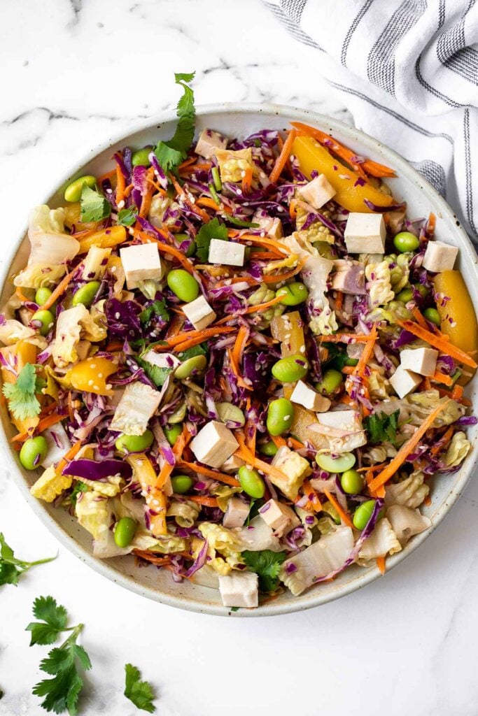 Asian chopped salad is a delicious and colorful salad, loaded with refreshing crisp vegetables, plant-based protein, and a homemade creamy sesame dressing. | aheadofthyme.com