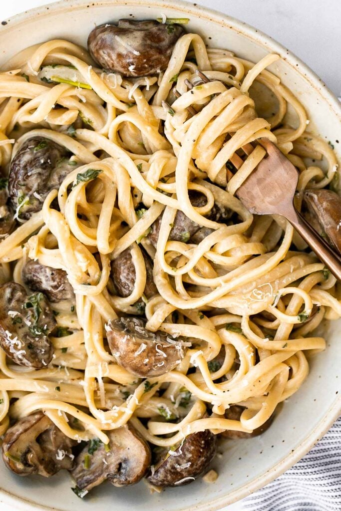 Creamy mushroom pasta is packed with buttery garlicky mushrooms swimming in a delicious creamy Parmesan sauce. Quick and easy make in 20 minutes. | aheadofthyme.com