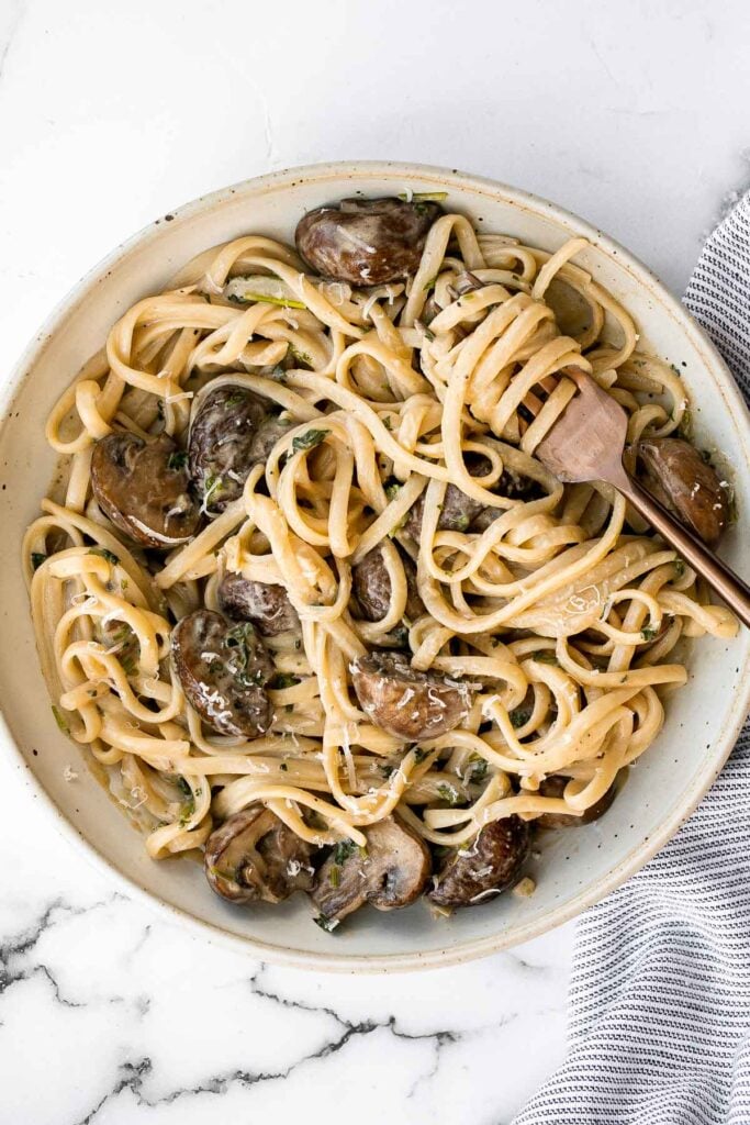 Creamy mushroom pasta is packed with buttery garlicky mushrooms swimming in a delicious creamy Parmesan sauce. Quick and easy make in 20 minutes. | aheadofthyme.com