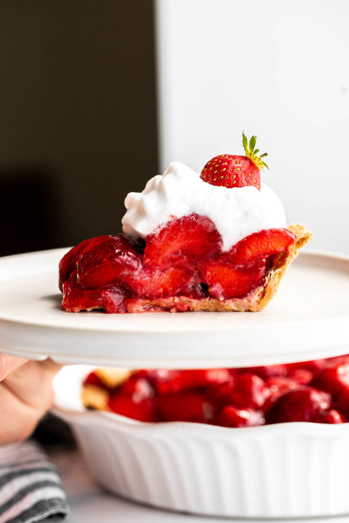 Fresh strawberry pie is a delicious, summer dessert loaded with juicy strawberries and homemade strawberry glaze with no jello, in a flakey pie crust. | aheadofthyme.com