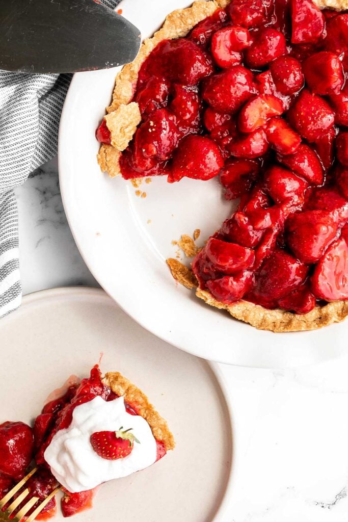 Fresh strawberry pie is a delicious, summer dessert loaded with juicy strawberries and homemade strawberry glaze with no jello, in a flakey pie crust. | aheadofthyme.com