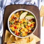 Fresh mango salsa is sweet, tangy, and delicious. It's a quick and easy recipe that you can whip up with just 6 ingredients and in under 10 minutes. | aheadofthyme.com