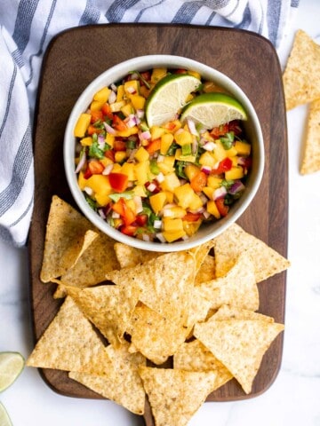 Fresh mango salsa is sweet, tangy, and delicious. It's a quick and easy recipe that you can whip up with just 6 ingredients and in under 10 minutes. | aheadofthyme.com