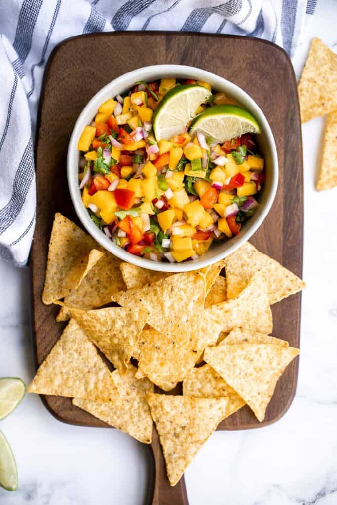 Fresh mango salsa is sweet, tangy, and delicious. It's a quick and easy recipe that you can whip up with just 6 ingredients and in under 10 minutes. | aheadofthyme.com