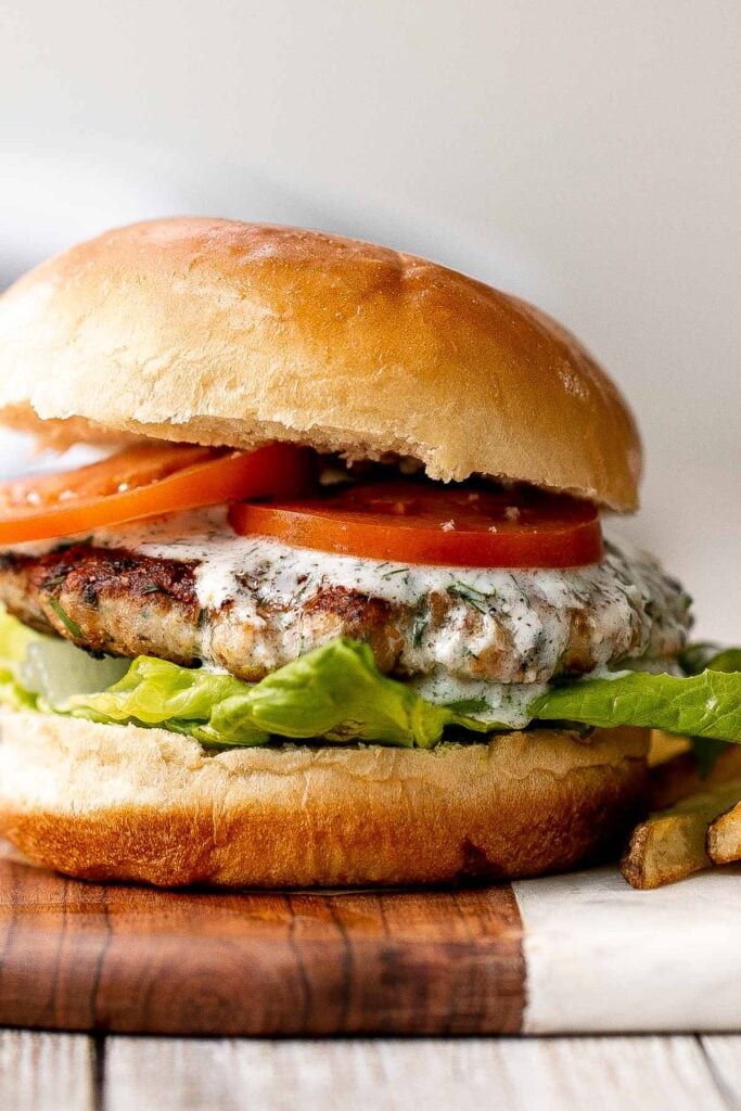 Mediterranean turkey burgers are tender, juicy, and delicious, loaded with garlic, fresh dill, and lemon juice. The perfect summer weeknight meal. | aheadofthyme.com