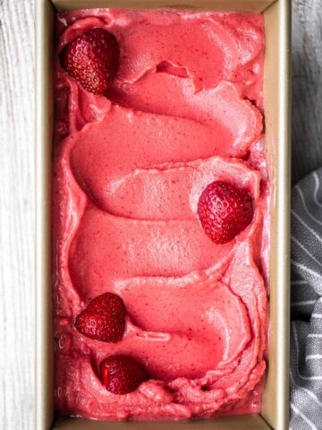 Homemade strawberry frozen yogurt is a delicious, refreshing, healthy dessert made with 4 simple ingredients, no refined sugar, and in less than 5 minutes. | aheadofthyme.com