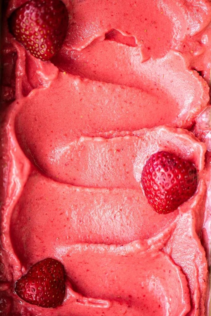 Homemade strawberry frozen yogurt is a delicious, refreshing, healthy dessert made with 4 simple ingredients, no refined sugar, and in less than 5 minutes. | aheadofthyme.com