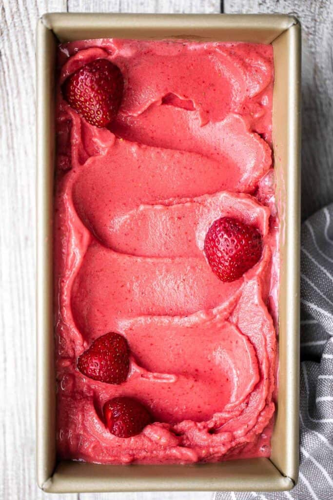 Homemade strawberry frozen yogurt is a delicious, refreshing, healthy dessert made with 4 simple ingredients, no refined sugar, and in less than 5 minutes. | aheadofthyme.com