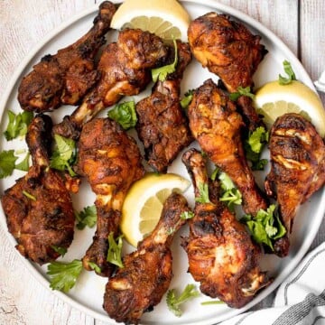 Tandoori chicken drumsticks are crispy outside, juicy and tender inside, and packed with flavor. An easy dinner to make in the oven, stovetop, or grill. | aheadofthyme.com