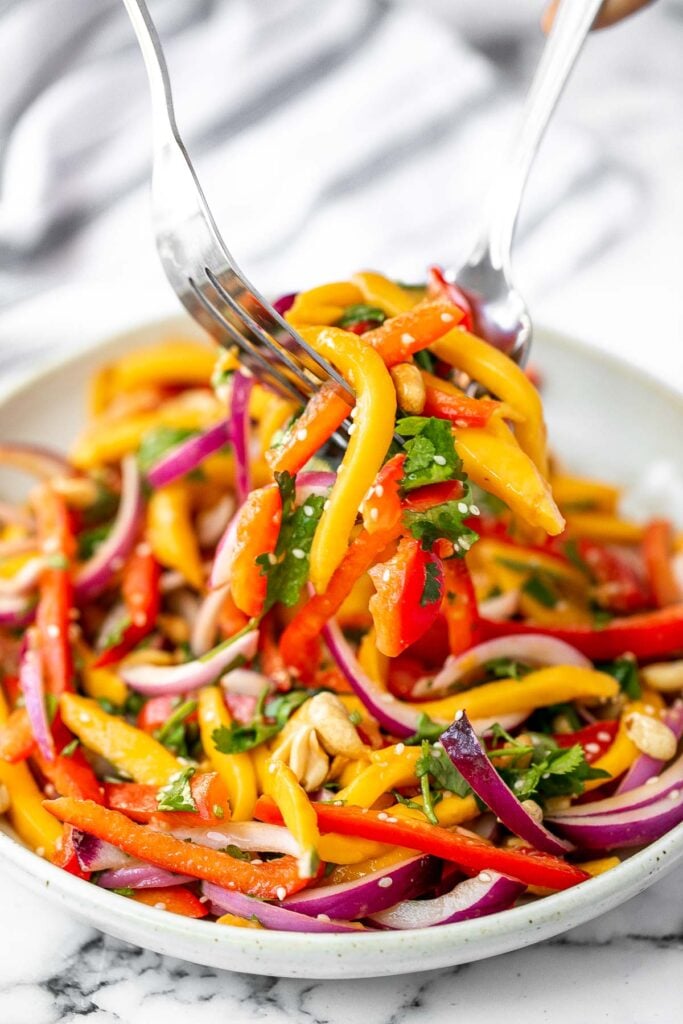 Thai mango salad is a refreshing and healthy dish that makes a great summer lunch or side dish. Easy to throw together in 10 minutes. | aheadofthyme.com