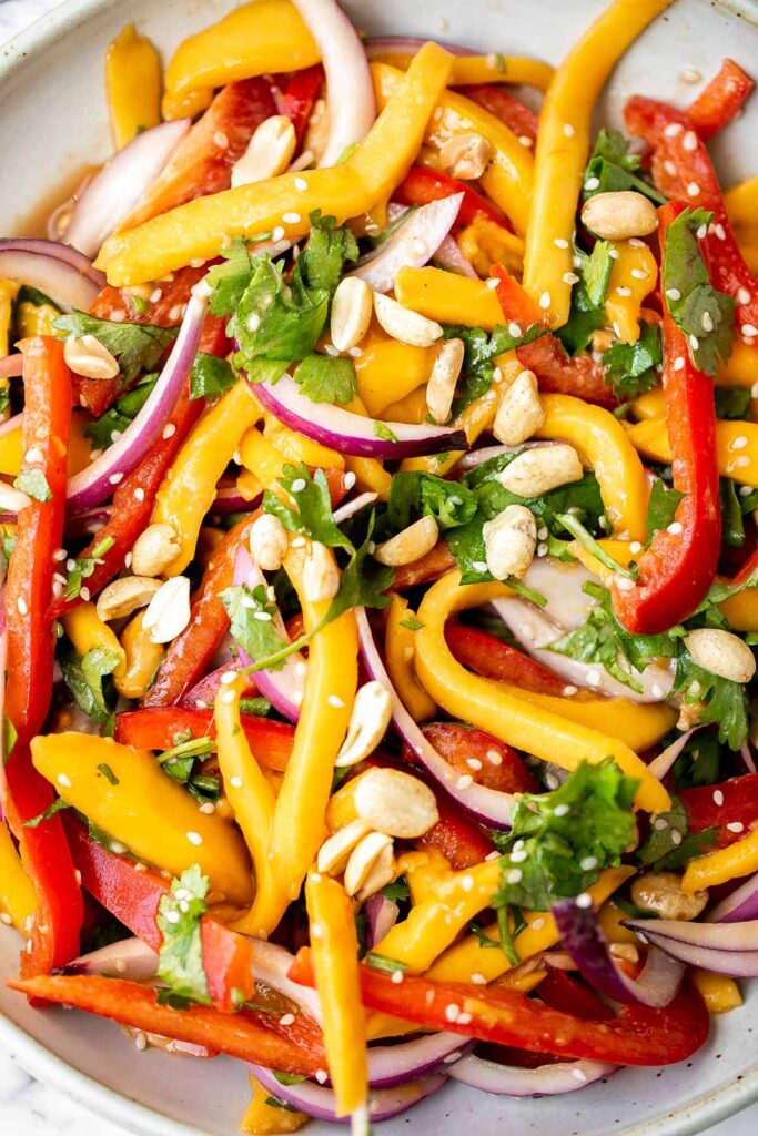 Thai mango salad is a refreshing and healthy dish that makes a great summer lunch or side dish. Easy to throw together in 10 minutes. | aheadofthyme.com