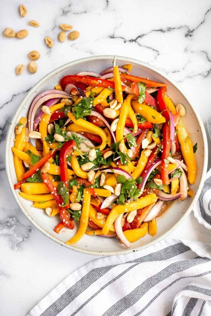 Thai mango salad is a refreshing and healthy dish that makes a great summer lunch or side dish. Easy to throw together in 10 minutes. | aheadofthyme.com