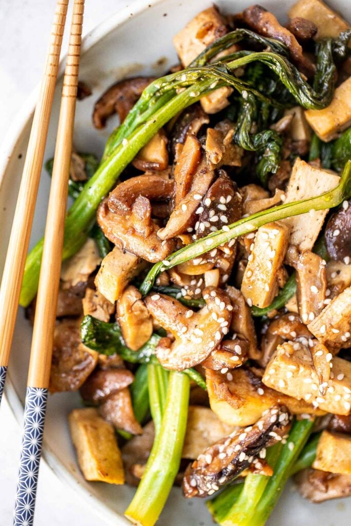 Quick, easy, and simple, vegan tofu and mushroom stir fry is a delicious meal that is ready in under 15 minutes. Serve it over a bowl of steamed rice. | aheadofthyme.com