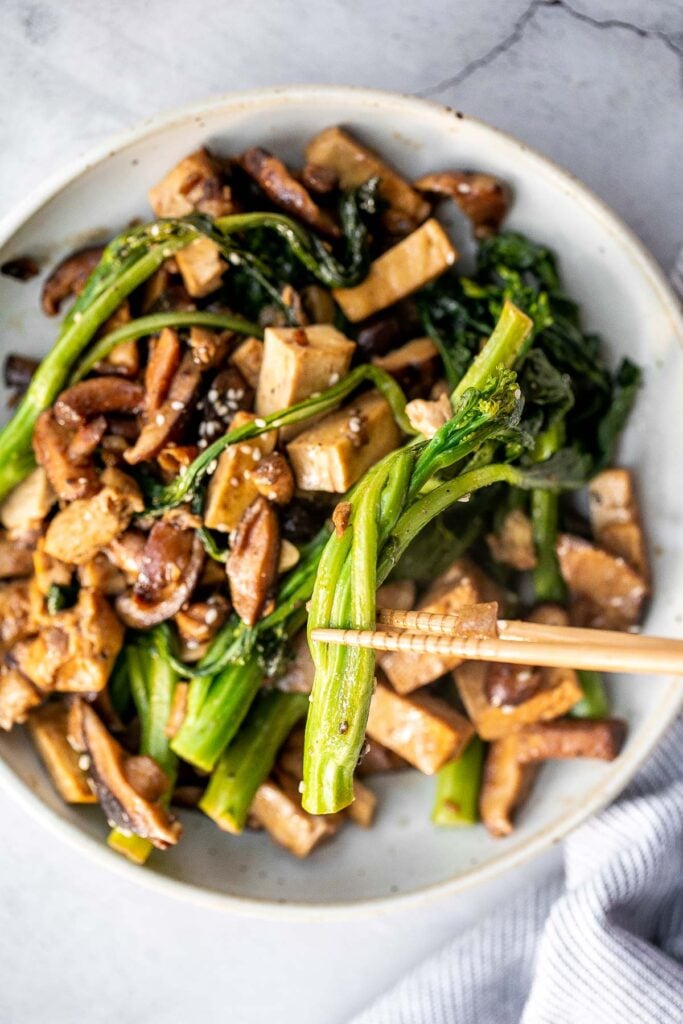 Quick, easy, and simple, vegan tofu and mushroom stir fry is a delicious meal that is ready in under 15 minutes. Serve it over a bowl of steamed rice. | aheadofthyme.com