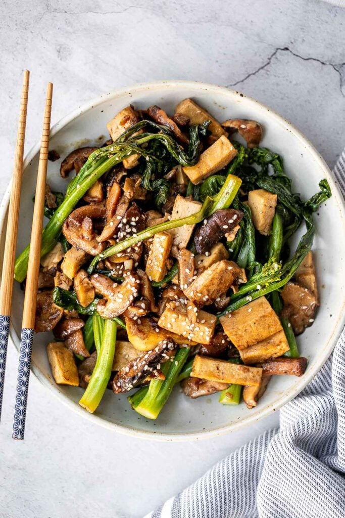 Quick, easy, and simple, vegan tofu and mushroom stir fry is a delicious meal that is ready in under 15 minutes. Serve it over a bowl of steamed rice. | aheadofthyme.com