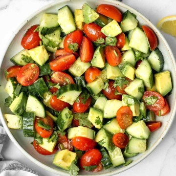 Simple tomato cucumber avocado salad with a delicious lemon vinaigrette is a light and refreshing salad that comes together in literally 5 minutes. | aheadofthyme.com