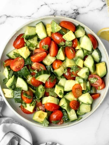 Simple tomato cucumber avocado salad with a delicious lemon vinaigrette is a light and refreshing salad that comes together in literally 5 minutes. | aheadofthyme.com